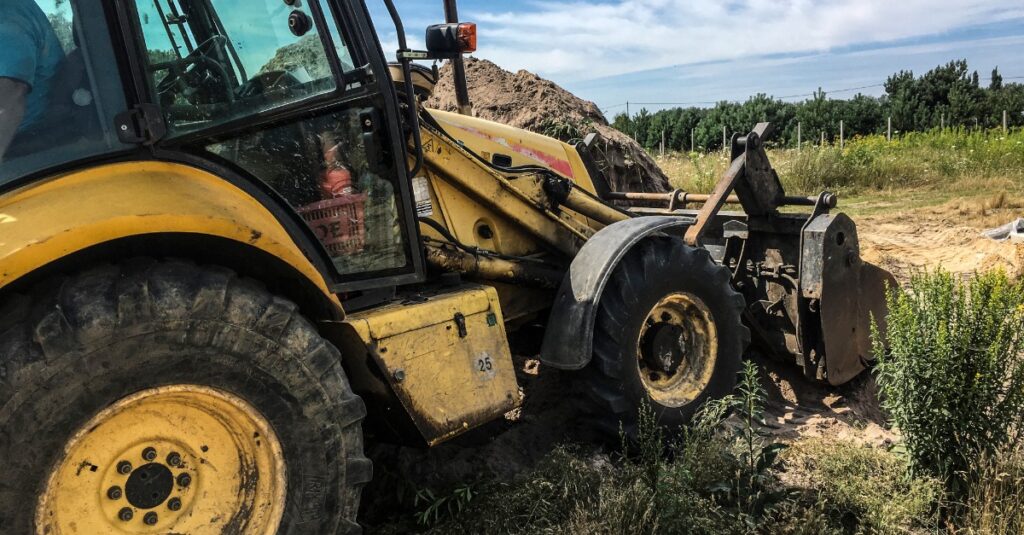 Skid steer forestry mulcher clearing land