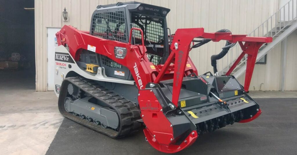 skid steer forestry drum mulcher assassinator in parking lot